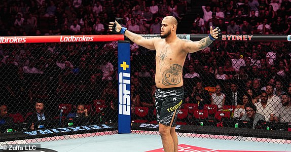 SYDNEY, AUSTRALIA - FEBRUARY 09: Tallison Teixeira of Brazil reacts after a knockout victory against Justin Tafa of New Zealand in a heavyweight fight during the UFC 312 event at Qudos Bank Arena on February 09, 2025 in Sydney, Australia.  (Photo by Jeff Bottari/Zuffa LLC)