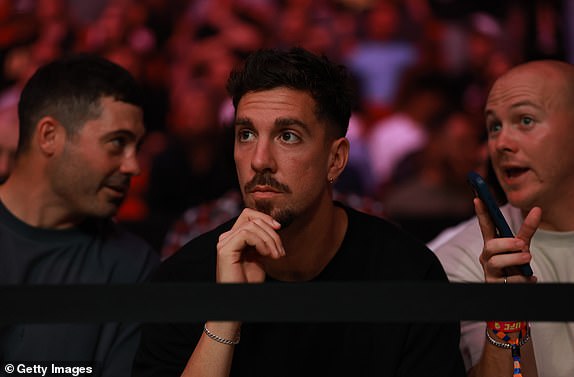 SYDNEY, AUSTRALIA - FEBRUARY 09: Australian tennis player Thanasi Kokkinakis looks on during UFC 312 at Qudos Bank Arena on February 09, 2025 in Sydney, Australia. (Photo by Darrian Traynor/Getty Images)