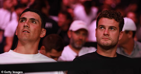 SYDNEY, AUSTRALIA - FEBRUARY 09: Sydney Swans players Justin McInerney and Tom Papley look on during UFC 312 at Qudos Bank Arena on February 09, 2025 in Sydney, Australia. (Photo by Darrian Traynor/Getty Images)