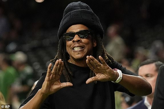 Jay-Z gestures from the sidelines prior to the NFL Super Bowl 59 football game between the Philadelphia Eagles and the Kansas City Chiefs, Sunday, Feb. 9, 2025, in New Orleans. (AP Photo/Frank Franklin II)