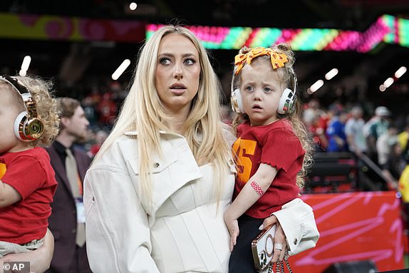 Brittany Mahomes looks on from the sideline before the NFL Super Bowl 59 football game between the Kansas City Chiefs and the Philadelphia Eagles Sunday, Feb. 9, 2025, in New Orleans. (AP Photo/Doug Benc)