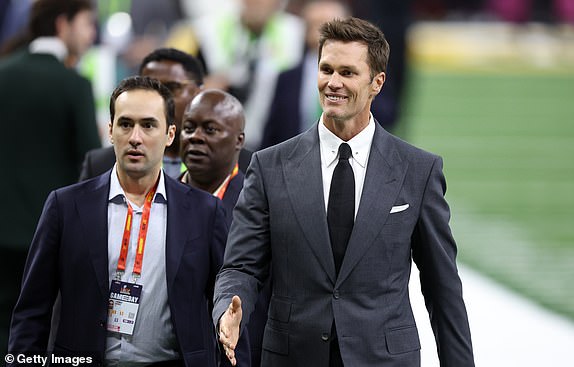 NEW ORLEANS, LOUISIANA - FEBRUARY 09: Tom Brady walks across the field before Super Bowl LIX between the Kansas City Chiefs and the Philadelphia Eagles at Caesars Superdome on February 09, 2025 in New Orleans, Louisiana. (Photo by Emilee Chinn/Getty Images)