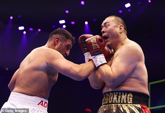 RIYADH, SAUDI ARABIA - FEBRUARY 22: Agit Kabayel punches Zhilei Zhang during the WBC Interim World Heavyweight Title fight between Zhilei Zhang and Agit Kabayel as part of Beterbiev v Bivol 2: The Last Crescendo at Kingdom Arena on February 22, 2025 in Riyadh, Saudi Arabia. (Photo by Richard Pelham/Getty Images)