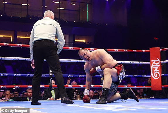 RIYADH, SAUDI ARABIA - FEBRUARY 22: Zhilei Zhang reacts to being knocked down and stopped by Agit Kabayel (not pictured) during the WBC Interim World Heavyweight Title fight between Zhilei Zhang and Agit Kabayel as part of Beterbiev v Bivol 2: The Last Crescendo at Kingdom Arena on February 22, 2025 in Riyadh, Saudi Arabia. (Photo by Richard Pelham/Getty Images)