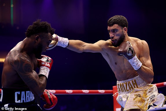 RIYADH, SAUDI ARABIA - FEBRUARY 22: Hamzah Sheeraz punches Carlos Adames during the WBC World Middleweight Title fight between Carlos Adames and Hamzah Sheeraz as part of Beterbiev v Bivol 2: The Last Crescendo at Kingdom Arena on February 22, 2025 in Riyadh, Saudi Arabia. (Photo by Richard Pelham/Getty Images)