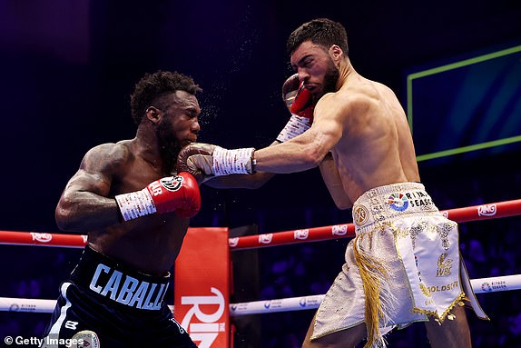 RIYADH, SAUDI ARABIA - FEBRUARY 22: Carlos Adames exchanges punches with Hamzah Sheeraz during the WBC World Middleweight Title fight between Carlos Adames and Hamzah Sheeraz as part of Beterbiev v Bivol 2: The Last Crescendo at Kingdom Arena on February 22, 2025 in Riyadh, Saudi Arabia. (Photo by Richard Pelham/Getty Images)