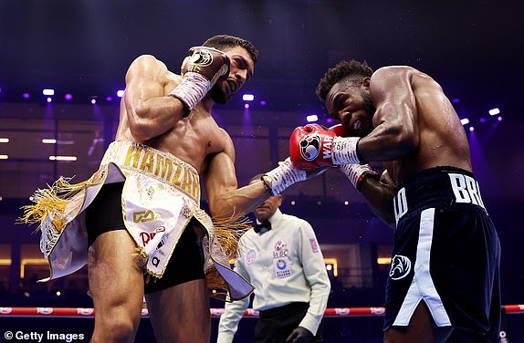 RIYADH, SAUDI ARABIA - FEBRUARY 22: Hamzah Sheeraz punches Carlos Adames during the WBC World Middleweight Title fight between Carlos Adames and Hamzah Sheeraz as part of Beterbiev v Bivol 2: The Last Crescendo at Kingdom Arena on February 22, 2025 in Riyadh, Saudi Arabia. (Photo by Richard Pelham/Getty Images)