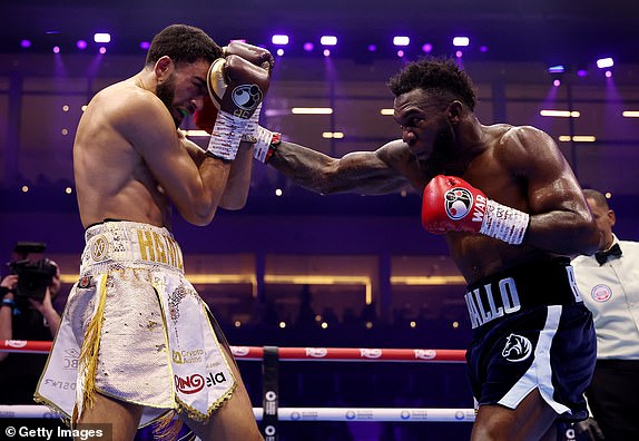 RIYADH, SAUDI ARABIA - FEBRUARY 22: Carlos Adames punches Hamzah Sheeraz during the WBC World Middleweight Title fight between Carlos Adames and Hamzah Sheeraz as part of Beterbiev v Bivol 2: The Last Crescendo at Kingdom Arena on February 22, 2025 in Riyadh, Saudi Arabia. (Photo by Richard Pelham/Getty Images)