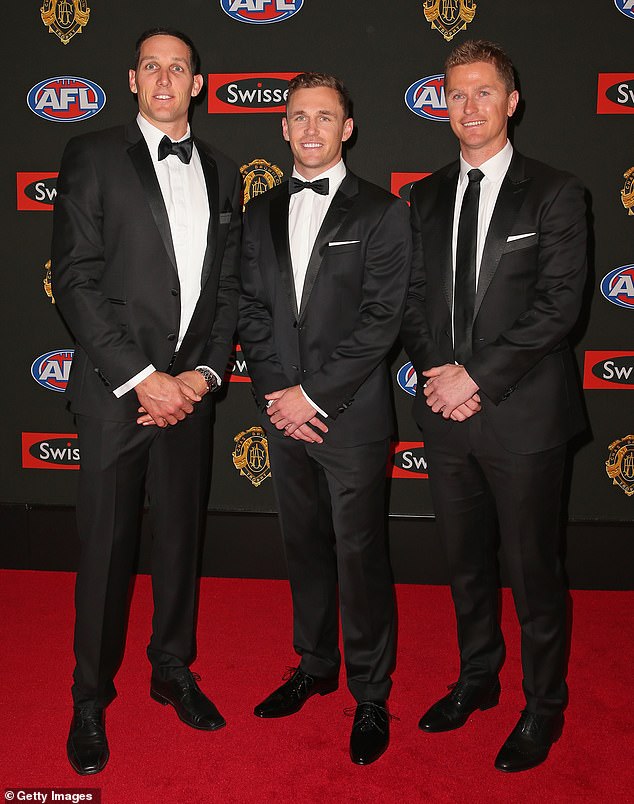 Troy (desno) prikazan je sa svojim mlađim bratom Joelom (centrom) i bivšom zvijezdom Geelong Harryjem Taylorom 2014. godine