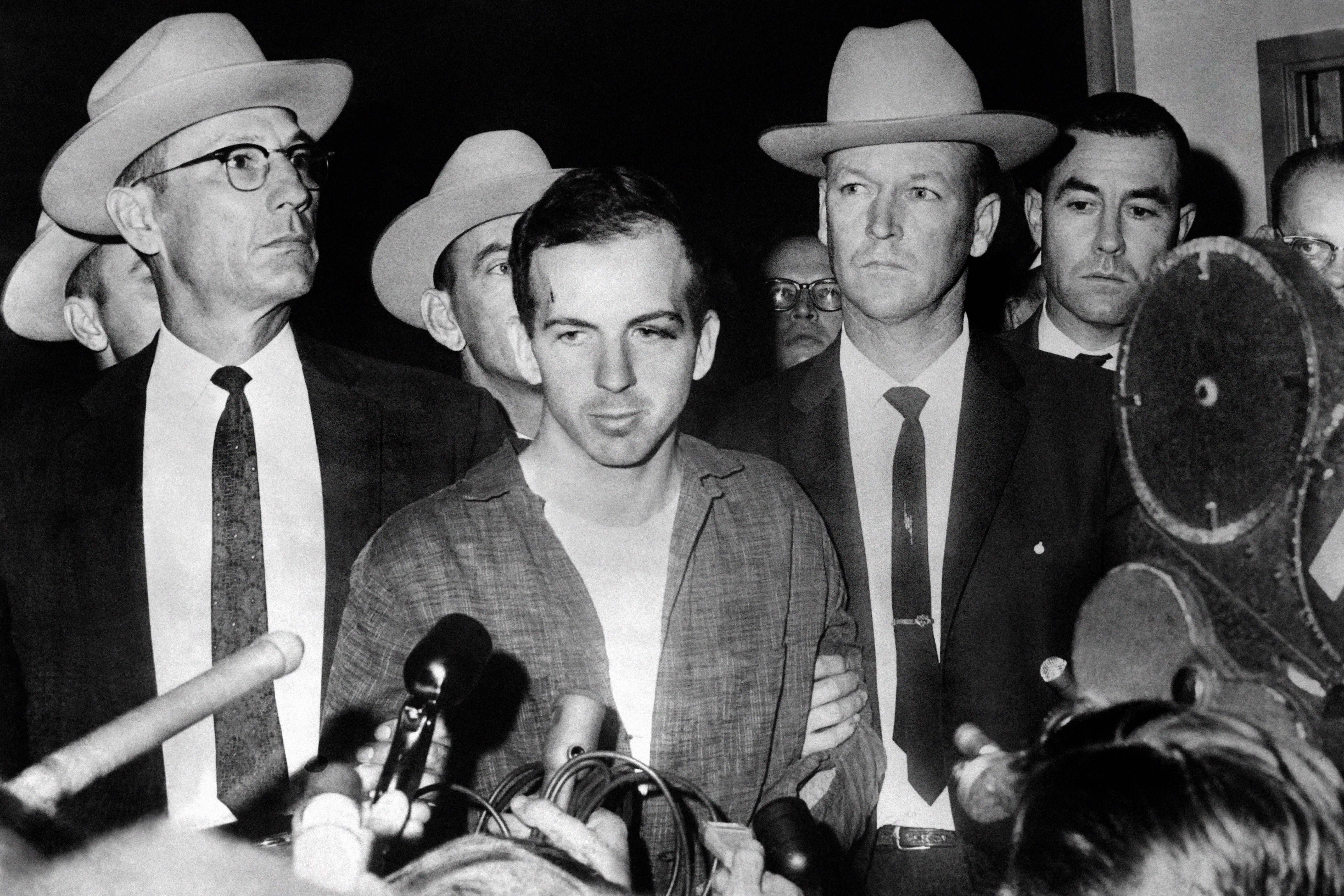 Lee Harvey Oswald pictured shortly after his arrest. The Warren Commission found he acted alone in killing the president