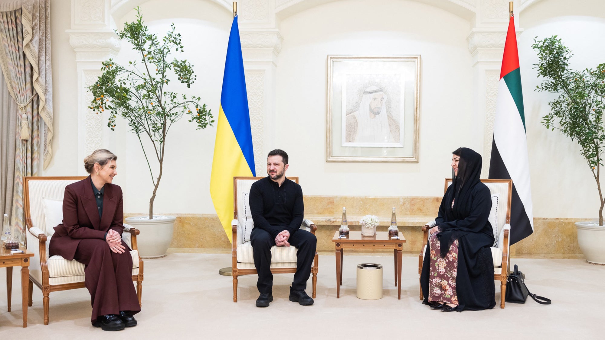 UAE Minister of State for International Cooperation Reem Al Hashimi greeting Ukraine's president Volodymyr Zelensky and his wife Olena Zelenska on their arrival in the United Arab Emirates