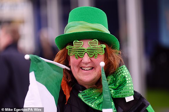 A racegoer on day three of the 2025 Cheltenham Festival at Cheltenham Racecourse. Picture date: Thursday March 13, 2025. PA Photo. See PA story RACING Cheltenham. Photo credit should read: Mike Egerton/PA Wire.RESTRICTIONS: Use subject to restrictions. Editorial use only, no commercial use without prior consent from rights holder.
