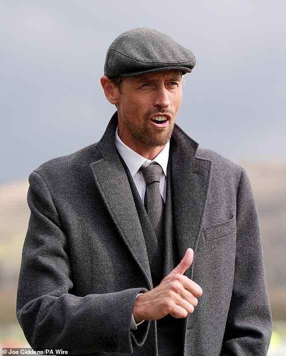 Former footballer Peter Crouch arrives on day three of the 2025 Cheltenham Festival at Cheltenham Racecourse. Picture date: Thursday March 13, 2025. PA Photo. See PA story RACING Cheltenham. Photo credit should read: Joe Giddens/PA Wire.RESTRICTIONS: Use subject to restrictions. Editorial use only, no commercial use without prior consent from rights holder.