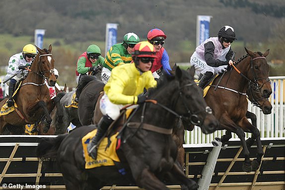 CHELTENHAM, ENGLAND - MARCH 13: Rachael Blackmore riding Air Of Entitlement (R, pink/black) on their way to winning The Ryanair Mares' Novices' Hurdle during Day Three of the 2025 Cheltenham Festival at Cheltenham Racecourse at on March 13, 2025 in Cheltenham, England. (Photo by Alan Crowhurst/Getty Images)