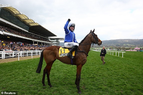 Horse Racing - Cheltenham Festival - Cheltenham Racecourse, Cheltenham, Britain - March 14, 2025 Jonjo O'Neill Jr riding Poniros celebrates after winning the 13:20 JCB Triumph Hurdle REUTERS/Matthew Childs