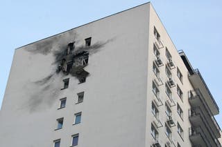 A view shows a damaged apartment building in a residential complex following a drone attack in the village of Sapronovo in the Moscow region on 11 March 2025