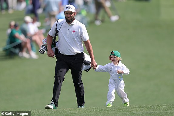 AUGUSTA, GEORGIA - APRIL 09: Jon Rahm of Spain walks with his son, Kepa Rahm, during the Par Three Contest prior to the 2025 Masters Tournament at Augusta National Golf Club on April 09, 2025 in Augusta, Georgia. (Photo by Andrew Redington/Getty Images)