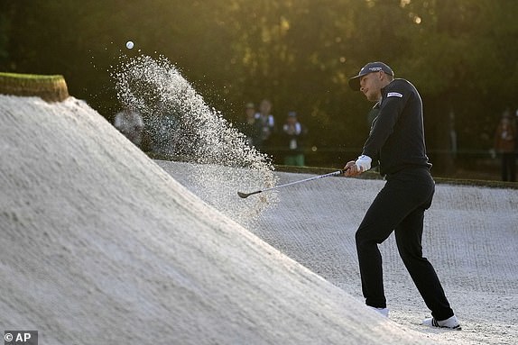 Nicolai Hojgaard, Denmark, hits from the bunker on the first hole during the first round at the Masters golf tournament, Thursday, April 10, 2025, in Augusta, Ga. (AP Photo/Ashley Landis)