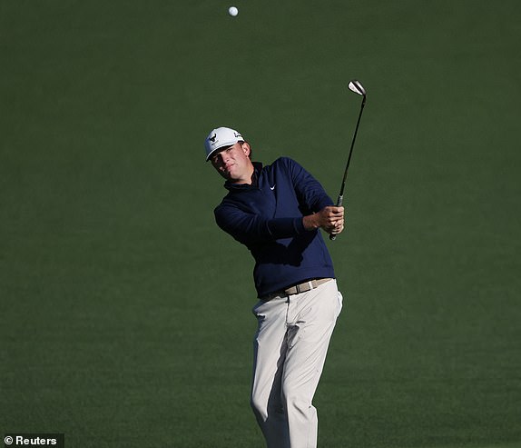 Golf - The Masters - Augusta National Golf Club, Augusta, Georgia, U.S. - April 8, 2025 Noah Kent of the U.S. hole hits his approach on the 2nd hole during a practice round REUTERS/Pilar Olivares