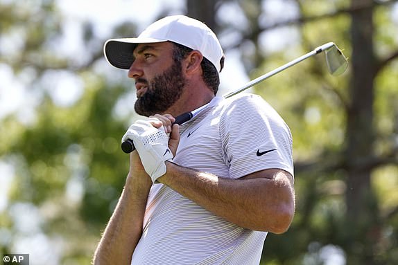 Scottie Scheffler watches his tee shot on the sixth hole during the first round at the Masters golf tournament, Thursday, April 10, 2025, in Augusta, Ga. (AP Photo/Julia Demaree Nikhinson)