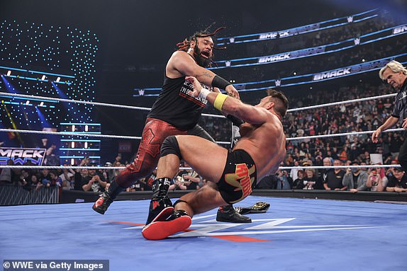 SEATTLE, WASHINGTON - APRIL 11: Jacob Fatu in action against LA Knight during SmackDown at Climate Pledge Arena on April 11, 2025 in Seattle, Washington.  (Photo by Eric Johnson/WWE via Getty Images)
