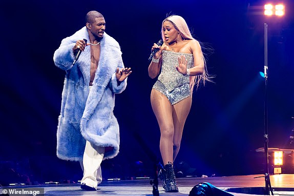 LONDON, ENGLAND - MAY 07:  (EDITOR'S NOTE: Image created using a star filter.)  Usher and Eve perform on stage on night ten of Usher's Past Present Future tour at The O2 Arena on May 07, 2025 in London, England. (Photo by Joseph Okpako/WireImage)