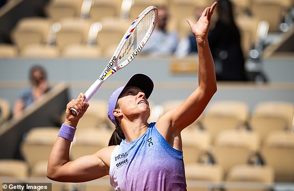 PARIS, FRANCE - MAY 26: Iga Swiatek of Poland in action against Rebecca Sramkova of Slovakia in the first round on Day Two of the French Open at Roland Garros on May 26, 2025 in Paris, France (Photo by Robert Prange/Getty Images)