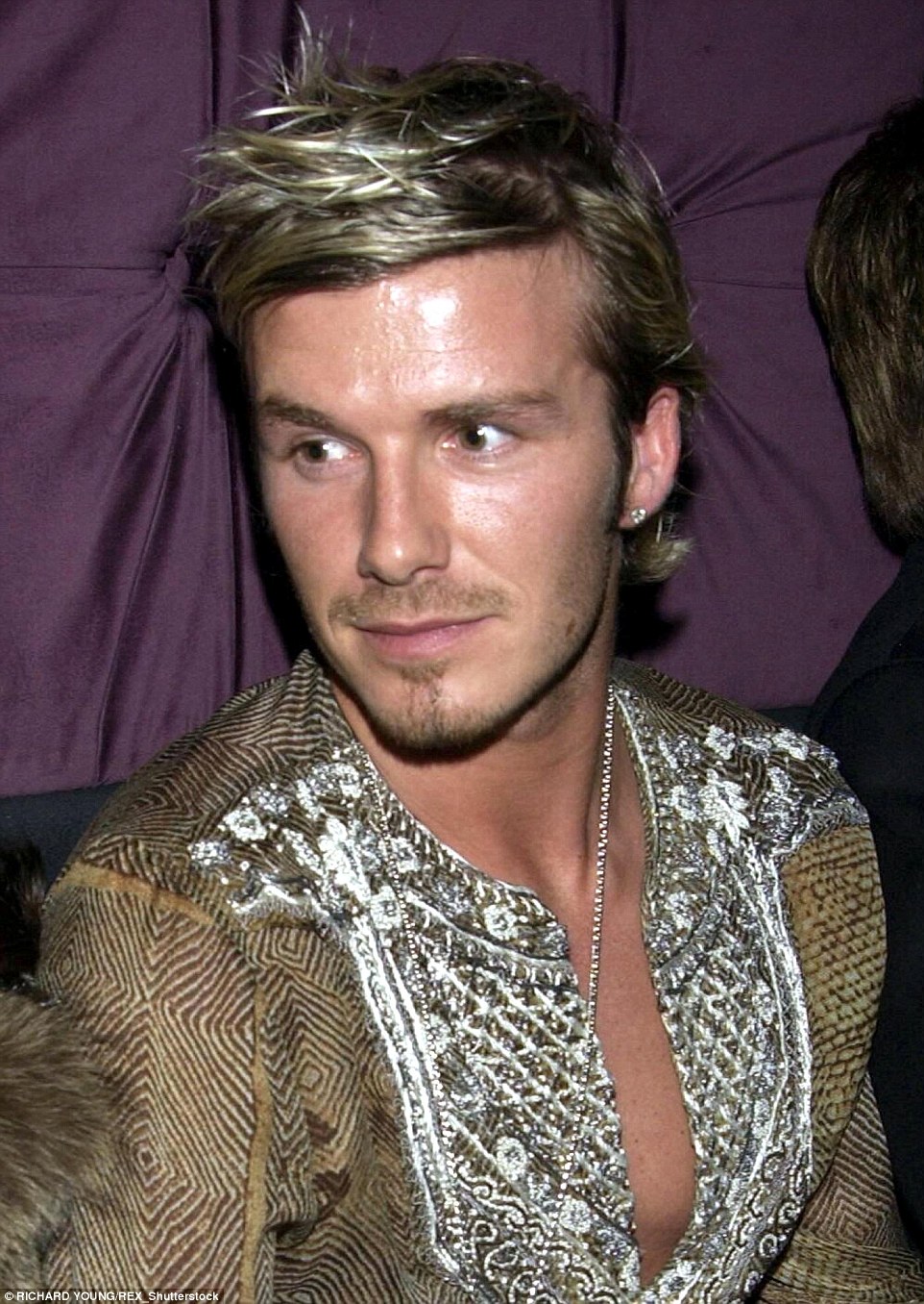 Beckham modeled a significantly smarter look at the 40th birthday party of close friend David Furnish in 2002