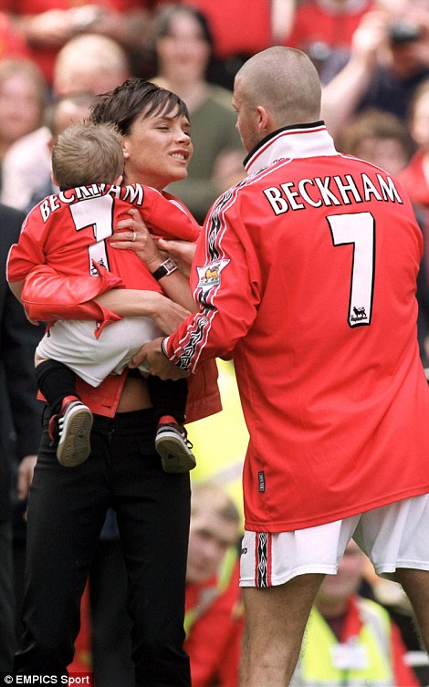 Victoria cheered her husband on during a league match in 2000