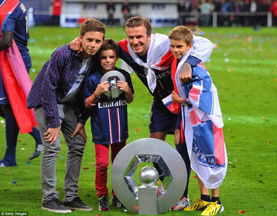 Beckham posed with his sons Brooklyn, Romeo and Cruz as his retirement celebrations began
