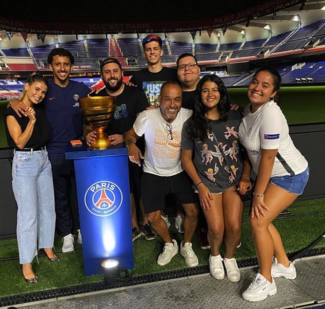 Marquinhos' (second from left) saw his parents' home burgled and French reports stated that his father Marcos (pictured centre in white) was struck in the face, chest and ribs by intruders