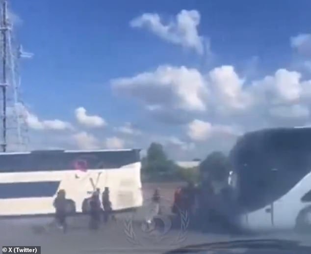 Footage on social media saw supporters surrounding buses carrying rival fans