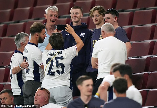 Wharton poses with his family at Euro 2024 - older brother Scott is still on Blackburn's books