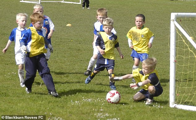 At Blackburn (in the dark blue away shirt, third from right), who he joined in 2010 aged six
