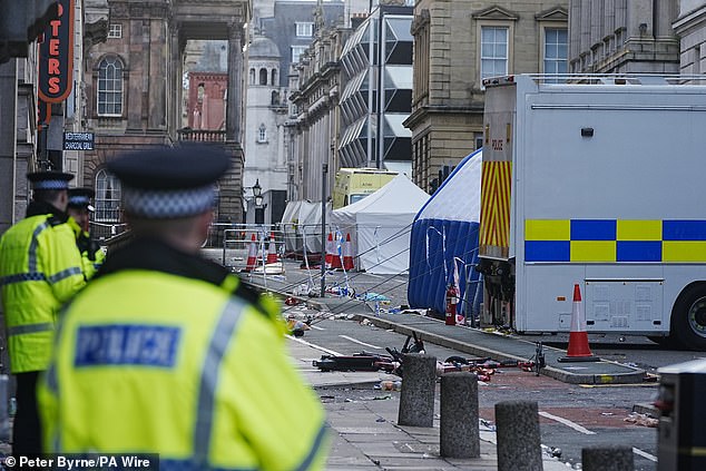 Police tents surrounded by debris at the scene in Water Street the morning after the terrifying incident