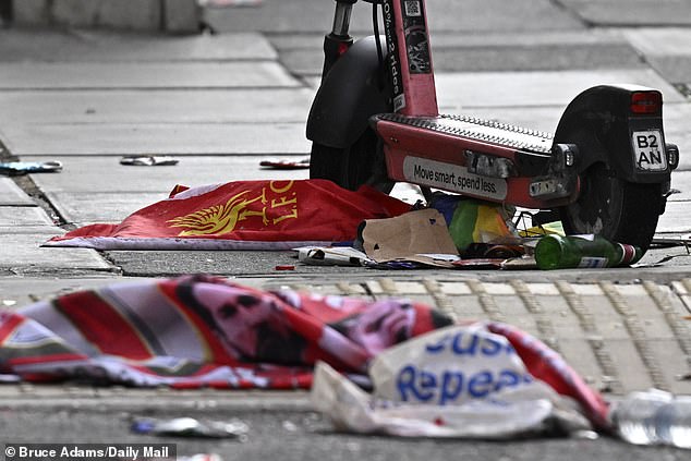 A Liverpool flag is left behind at the scene as pedestrians fled the scenes of horror