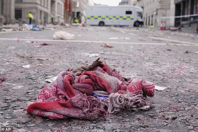 A Liverpool fan scarf was left behind as the joyous trophy parade turned into a day of horror
