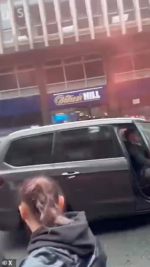 The driver slams it shut and speeds off