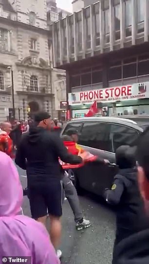 A fan tries to open the door