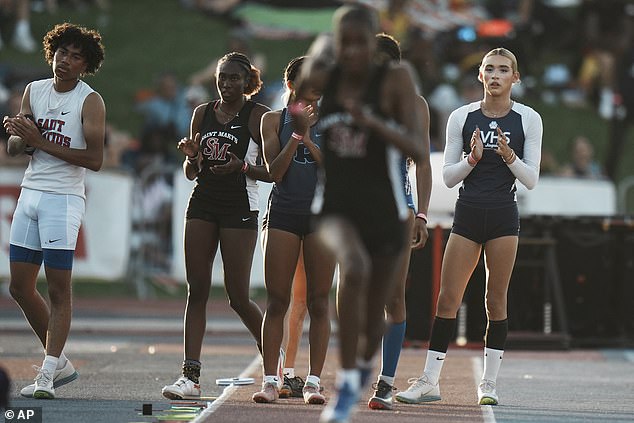 AB Hernandez watches other athletes warm up before the triple jump at the California high school track-and-field championship