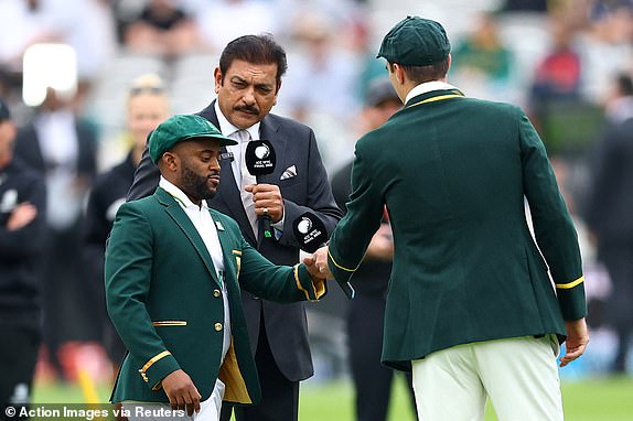 Cricket - 2025 ICC World Test Championship Final - South Africa v Australia - Lord's Cricket Ground, London, Britain - June 11, 2025 Australia's Pat Cummins with South Africa's Temba Bavuma during the coin toss as former India cricketer and commentator Ravi Shastri looks on Action Images via Reuters/Andrew Boyers