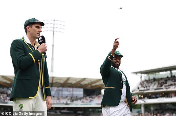 LONDON, ENGLAND - JUNE 11: Temba Bavuma of South Africa tosses the coin alongside Pat Cummins of Australia prior to Day One of the ICC World Test Championship Final 2025 between South Africa and Australia at Lord's Cricket Ground on June 11, 2025 in London, England.  (Photo by Alex Davidson-ICC/ICC via Getty Images)