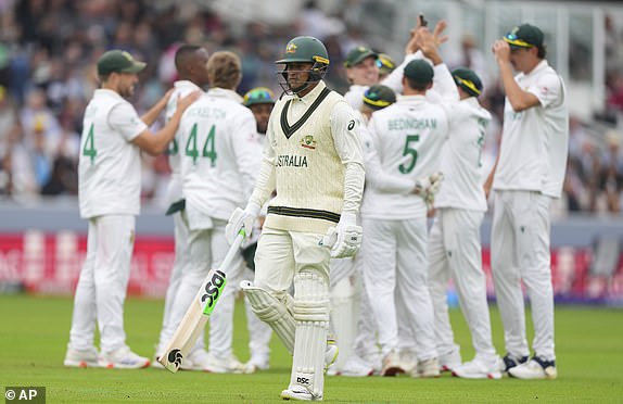 Australia's Usman Khawaja walks off the field after losing his wicket during the World Test Championship final between South Africa and Australia at Lord's cricket ground in London, Wednesday, June 11, 2025. (AP Photo/Kirsty Wigglesworth)