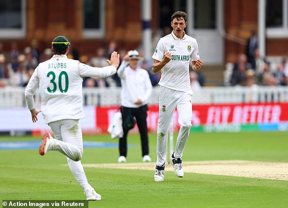 Cricket - 2025 ICC World Test Championship Final - South Africa v Australia - Lord's Cricket Ground, London, Britain - June 11, 2025 South Africa's Marco Jansen celebrates with Tristan Stubbs after taking the wicket of Australia's Travis Head, caught out by Kyle Verreynne Action Images via Reuters/Andrew Boyers