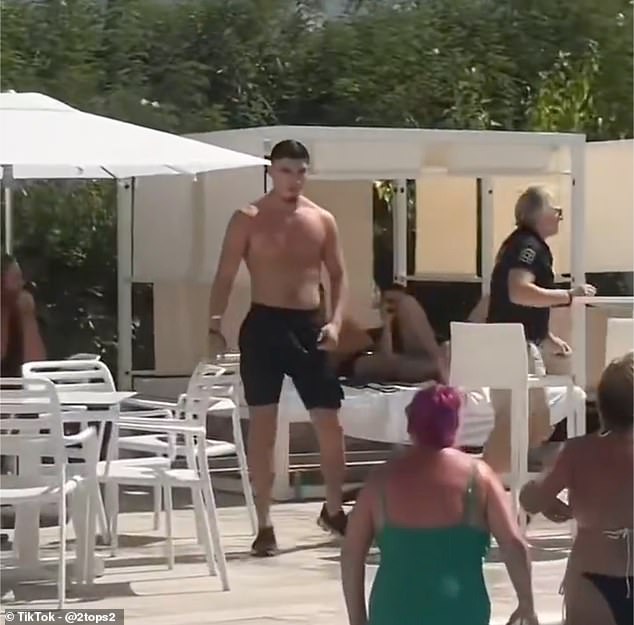 Oldham napadač Kian Harratt snimljen je lansirajući stolicu u smjeru žene u odmaralištu Ibiza