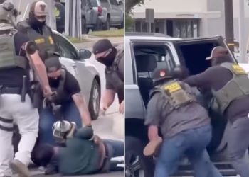 Čini se da šokantni video prikazuje oca trojice američkih marinaca koje su na parkiralištu pretukli maskirani agenti