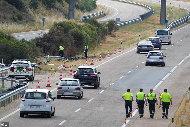 Investigators at the scene of the crash near Zamora, Spain today