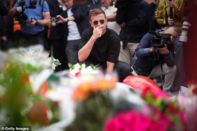 He was overwhelmed as he looked at the flowers and other tributes