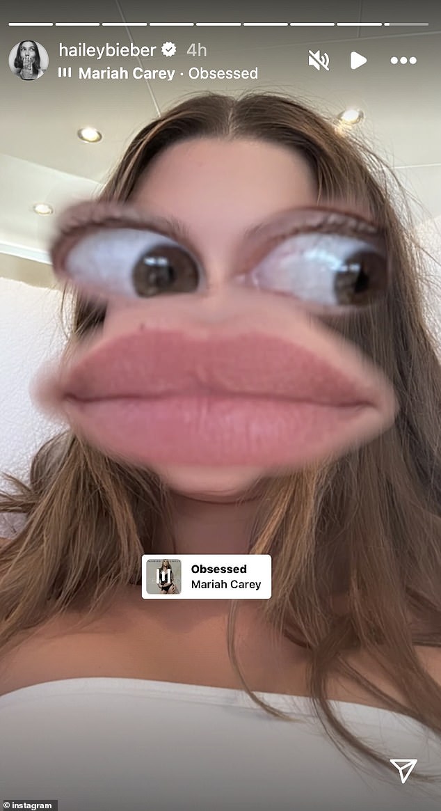 Potom je dodala stazu opsjednuta Mariah Carey da se igra u pozadini - koja je možda bila usmjerena prema Braunovim komentarima nad Bieberovim LP -om koji je pao u petak