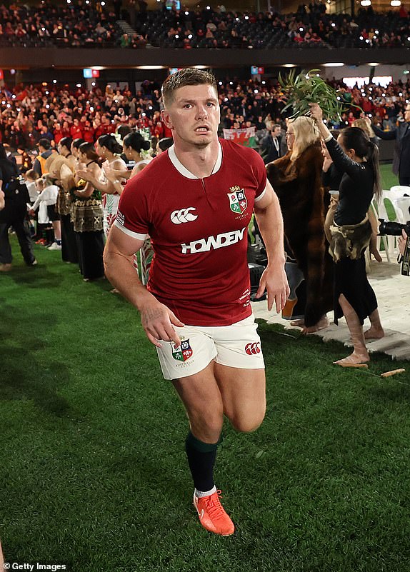 MELBOURNE, AUSTRALIA - JULY 22:  Owen Farrell, match day captain, of the British & Irish Lions leads his team onto the field during the First Nations & Pasifika v the Bristish & Irish Lions match held at the Marvel Stadium on July 22, 2025 in Melbourne, Australia.  (Photo by David Rogers/Getty Images)